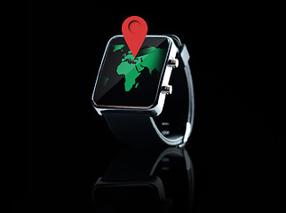 Image showing close up of smart watch with world map projection