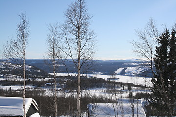 Image showing Cabins and winter landscape