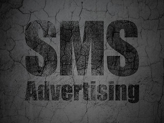 Image showing Marketing concept: SMS Advertising on grunge wall background