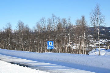 Image showing Winter road with tourist information sign