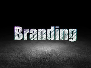 Image showing Marketing concept: Branding in grunge dark room