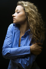 Image showing Attractive brunette woman in blue shirt