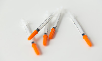 Image showing close up of insulin syringes on table