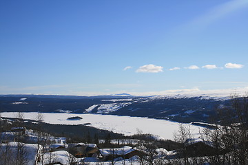 Image showing Frozen lake and cabin area