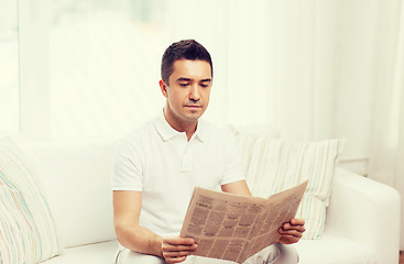 Image showing man reading newspaper at home