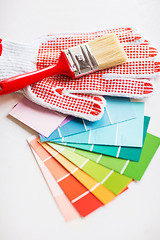 Image showing paintbrush, gloves and pantone samplers