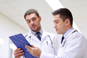 Image showing two doctors at hospital with clipboard