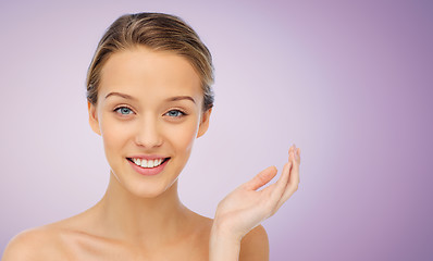 Image showing smiling young woman face and shoulders