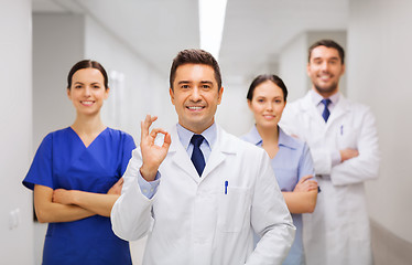 Image showing group of medics at hospital showing ok hand sign