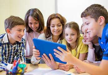 Image showing group of kids with teacher and tablet pc at school