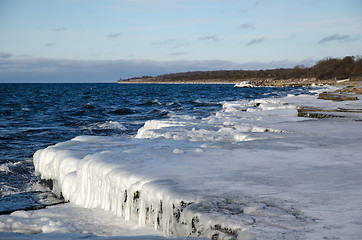 Image showing Ice covered flat rock coast