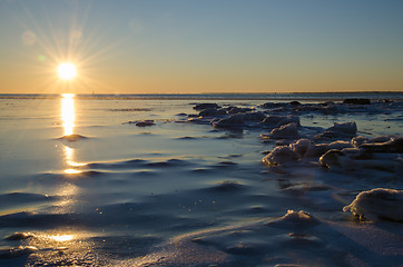 Image showing Sunshine at an icy winter coast