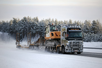 Image showing Volvo FH16 Hauls Excavator on Motorway