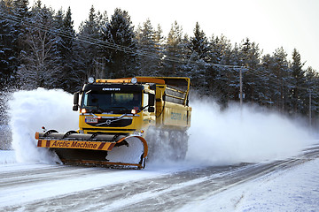 Image showing Volvo FM Truck and Snow Plow Clears Winter Road