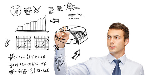 Image showing buisnessman drawing plan on virtual screen