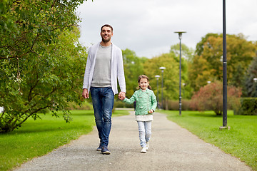 Image showing happy family walking in summer park