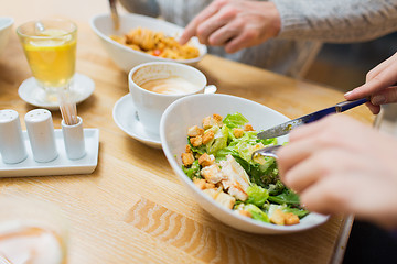 Image showing close up friends having dinner at restaurant