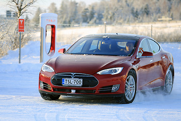 Image showing Red Tesla Model S Electric Car in Winter Snow