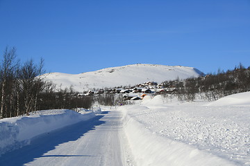 Image showing Mountain road and cabins in winter