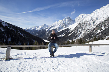 Image showing Young man enjoys winter landscape