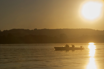 Image showing Motor boat, sunset at the lake