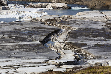 Image showing Glacial ice float away on a river bank, Iceland