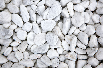 Image showing White stones at a grave as a background