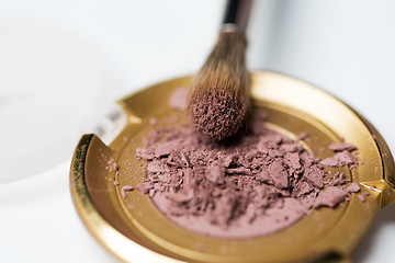 Image showing close up of makeup brush and eyeshadow