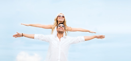 Image showing couple holding hands up at sea side