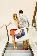 Image showing happy young couple with shopping bags in mall