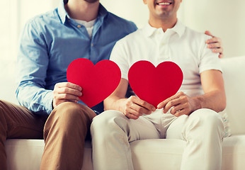 Image showing close up of happy gay male couple with red hearts