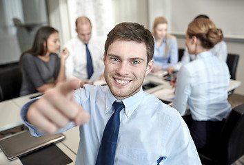 Image showing group of smiling businesspeople meeting in office