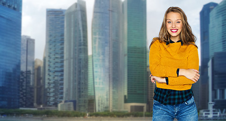 Image showing happy young woman or teen girl over city