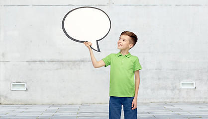 Image showing happy boy holding blank white text bubble banner