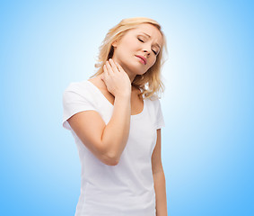 Image showing unhappy woman suffering from neck pain