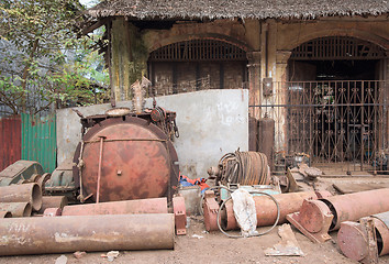 Image showing Rusty machine parts on the street in Myanmar