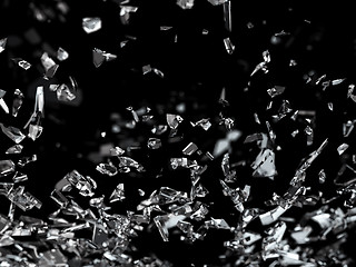 Image showing Pieces of splitted glass on black shallow dof