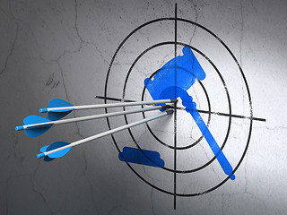 Image showing Law concept: arrows in Gavel target on wall background