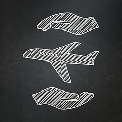 Image showing Insurance concept: Airplane And Palm on chalkboard background