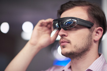 Image showing man using virtual reality gadget computer glasses