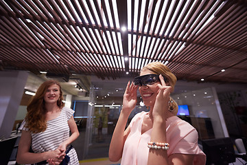 Image showing woman using virtual reality gadget computer glasses