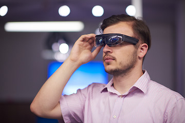 Image showing man using virtual reality gadget computer glasses