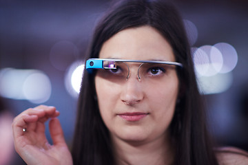 Image showing woman using virtual reality gadget computer glasses