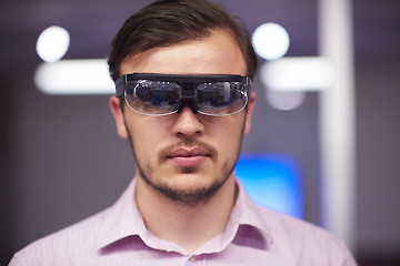 Image showing man using virtual reality gadget computer glasses