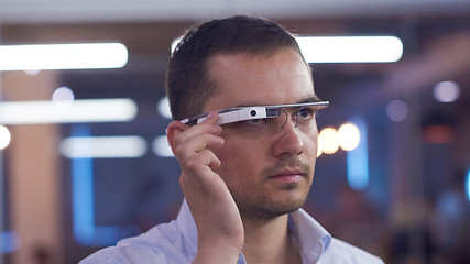Image showing man using virtual reality gadget computer glasses