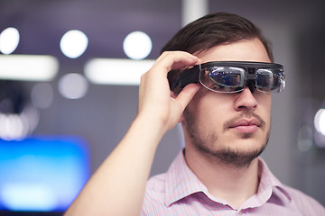 Image showing man using virtual reality gadget computer glasses