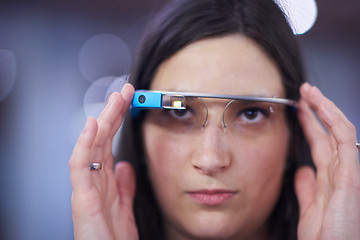 Image showing woman using virtual reality gadget computer glasses