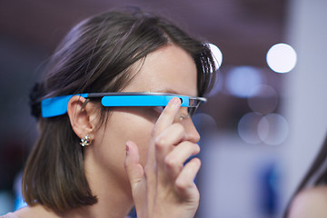 Image showing woman using virtual reality gadget computer glasses