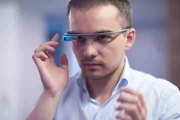 Image showing man using virtual reality gadget computer glasses