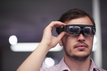 Image showing man using virtual reality gadget computer glasses